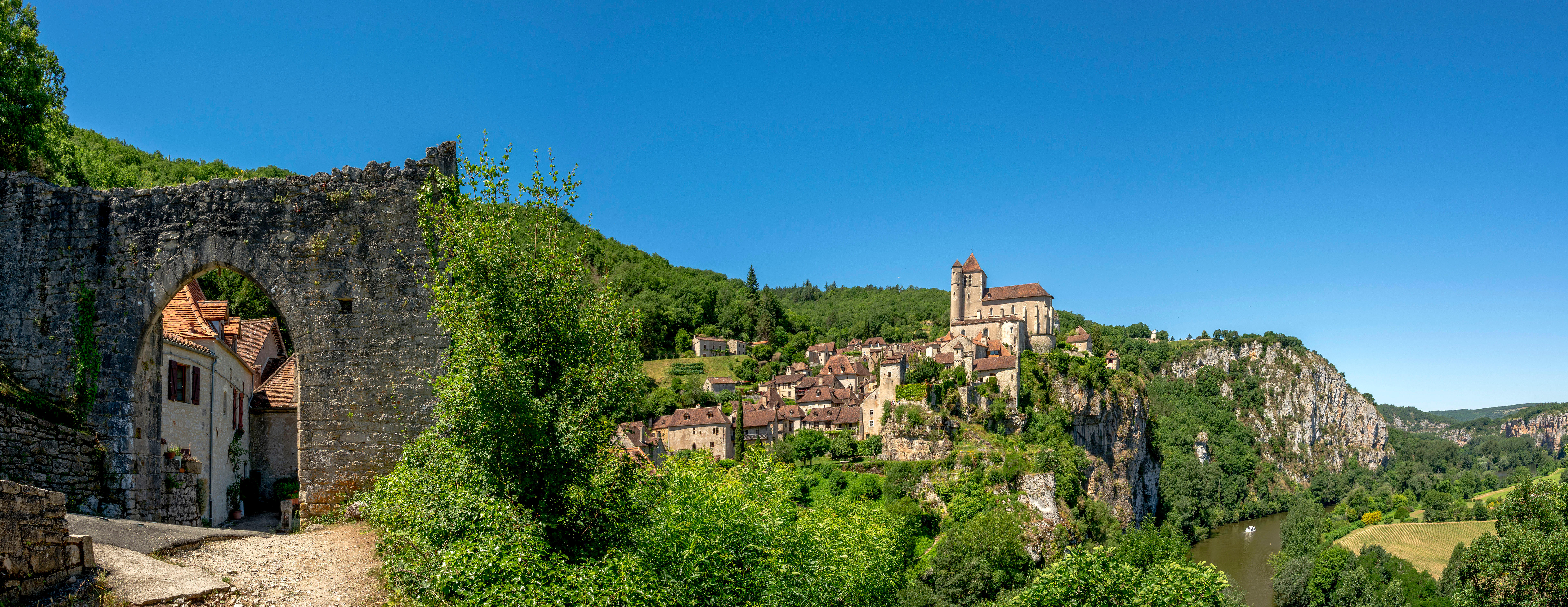 Occitania medieval stone bridge and village